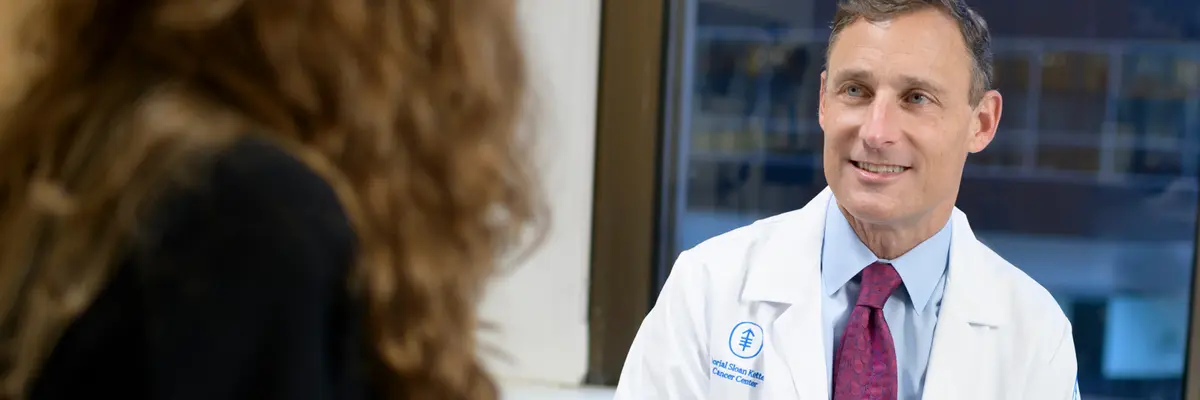 Colorectal surgeon Dr. Martin R. Weiser, who treats people with colon cancer in New York City, talks with a patient.