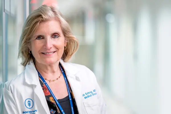 MSK gastrointestinal oncologist Dr. Deb Schrag is in a hallway at MSK in New York City.    