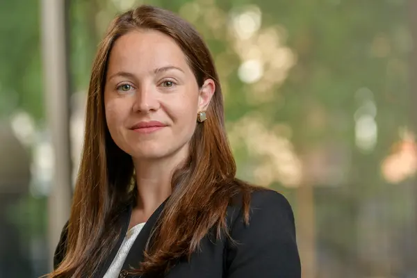 Colorectal surgeon Dr. Maria Widmar at MSK, standing with a window behind her. 