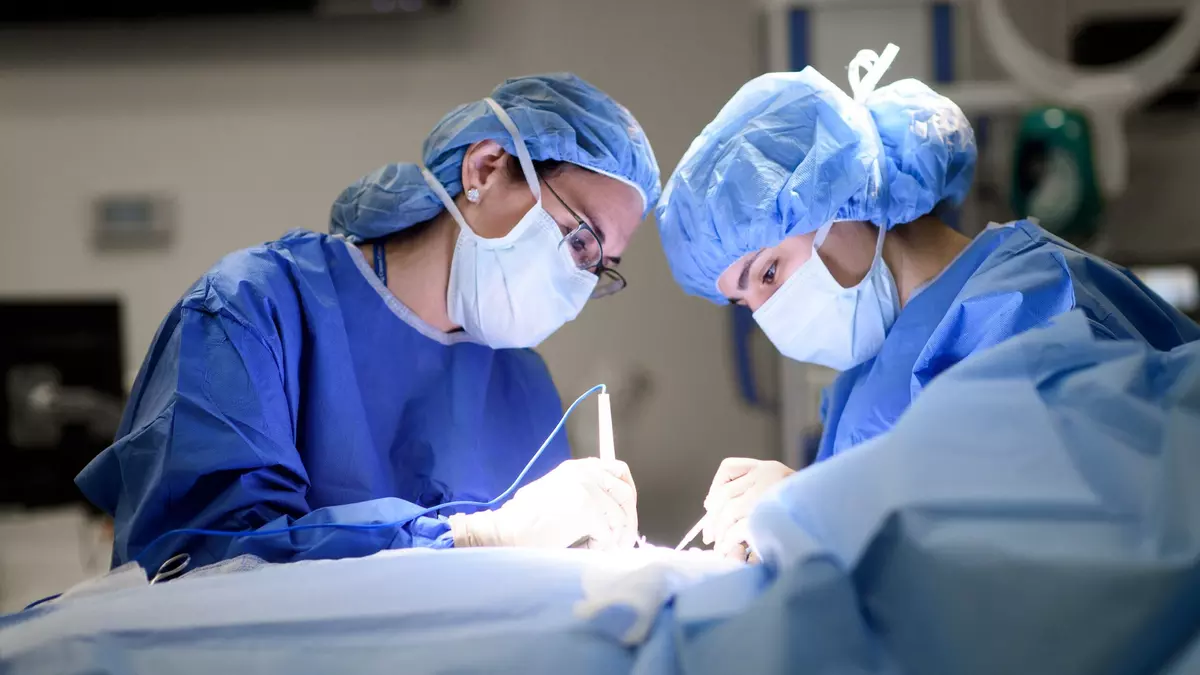 Breast surgeon Dr. Laurie Kirstein is shown during breast surgery.