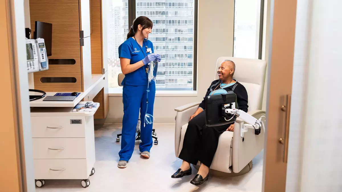 A clinical nurse with a patient at the David H. Koch Center for Cancer Care