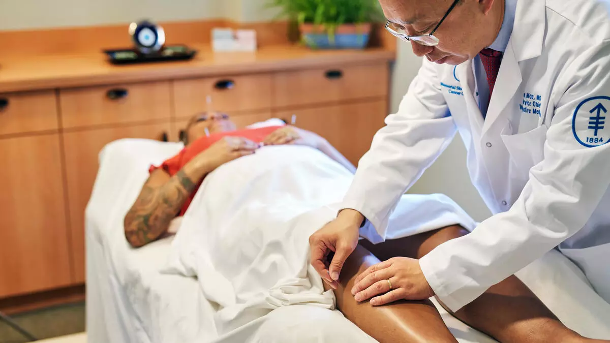 Dr. Jun Mao performs acupuncture