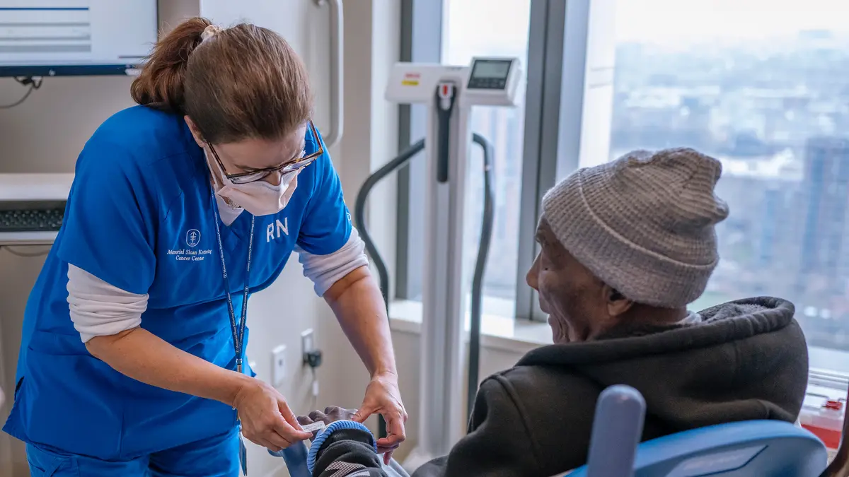 Registered nurse Samantha Nettle is with a patient. 