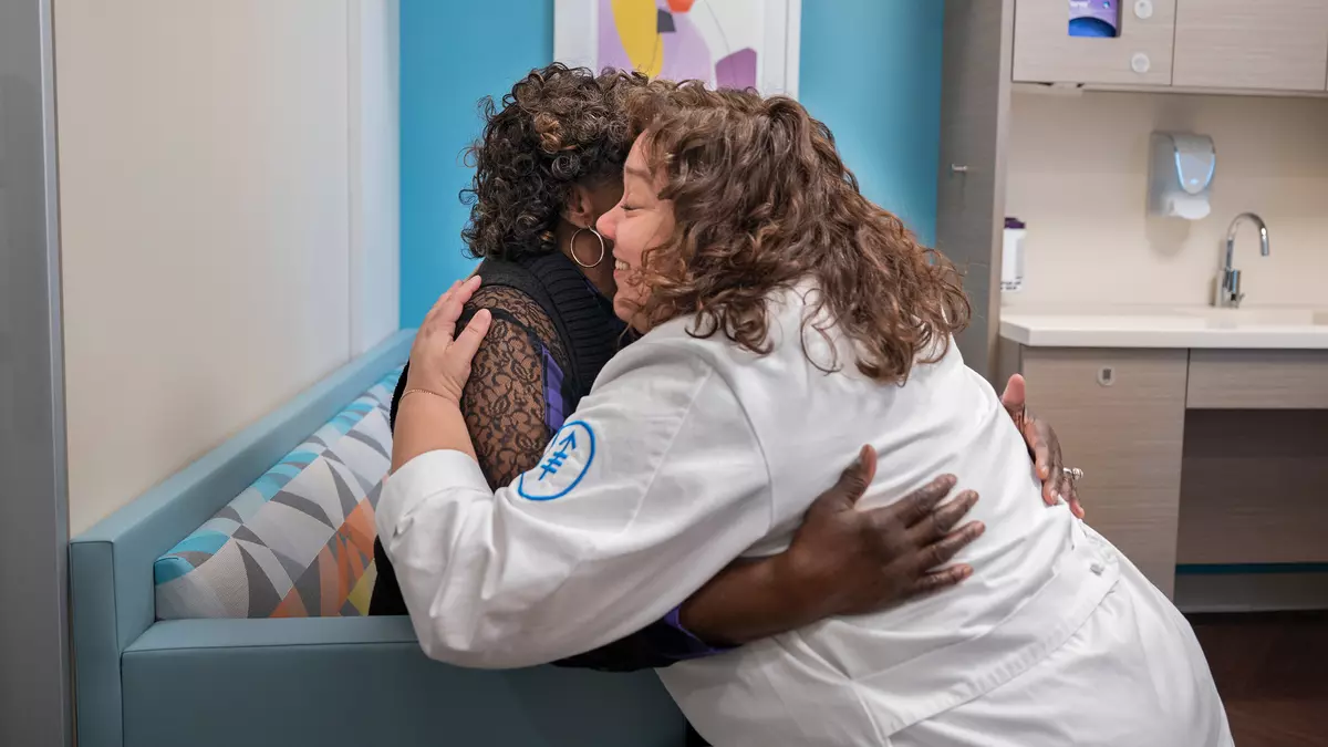 a provider hugging a patient