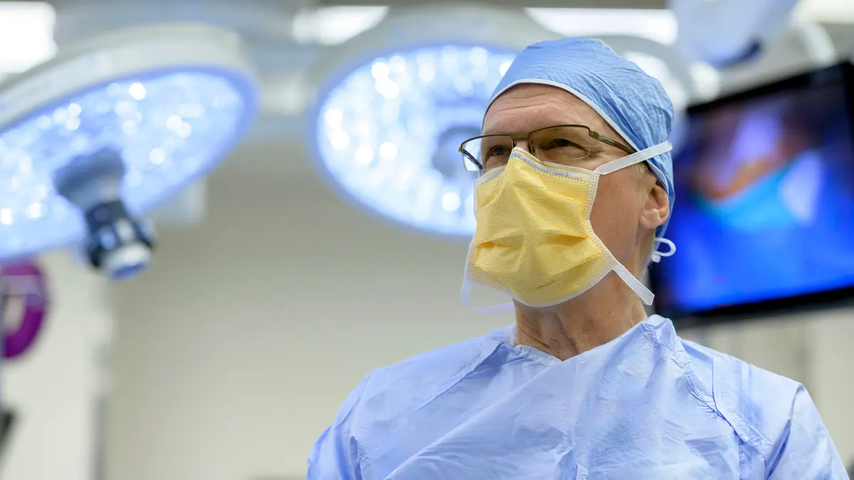 Colorectal surgeon Dr. Philip Paty, who treats colon cancer in New York City, is in surgical gear in an MSK surgical suite. 