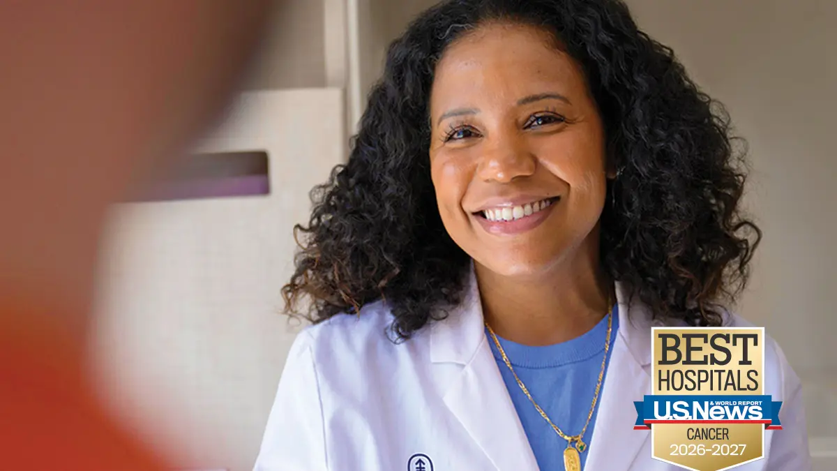 Nurse Practitioner Desiree Robinson pictured next to the US News & World Report badge for 2026-2027