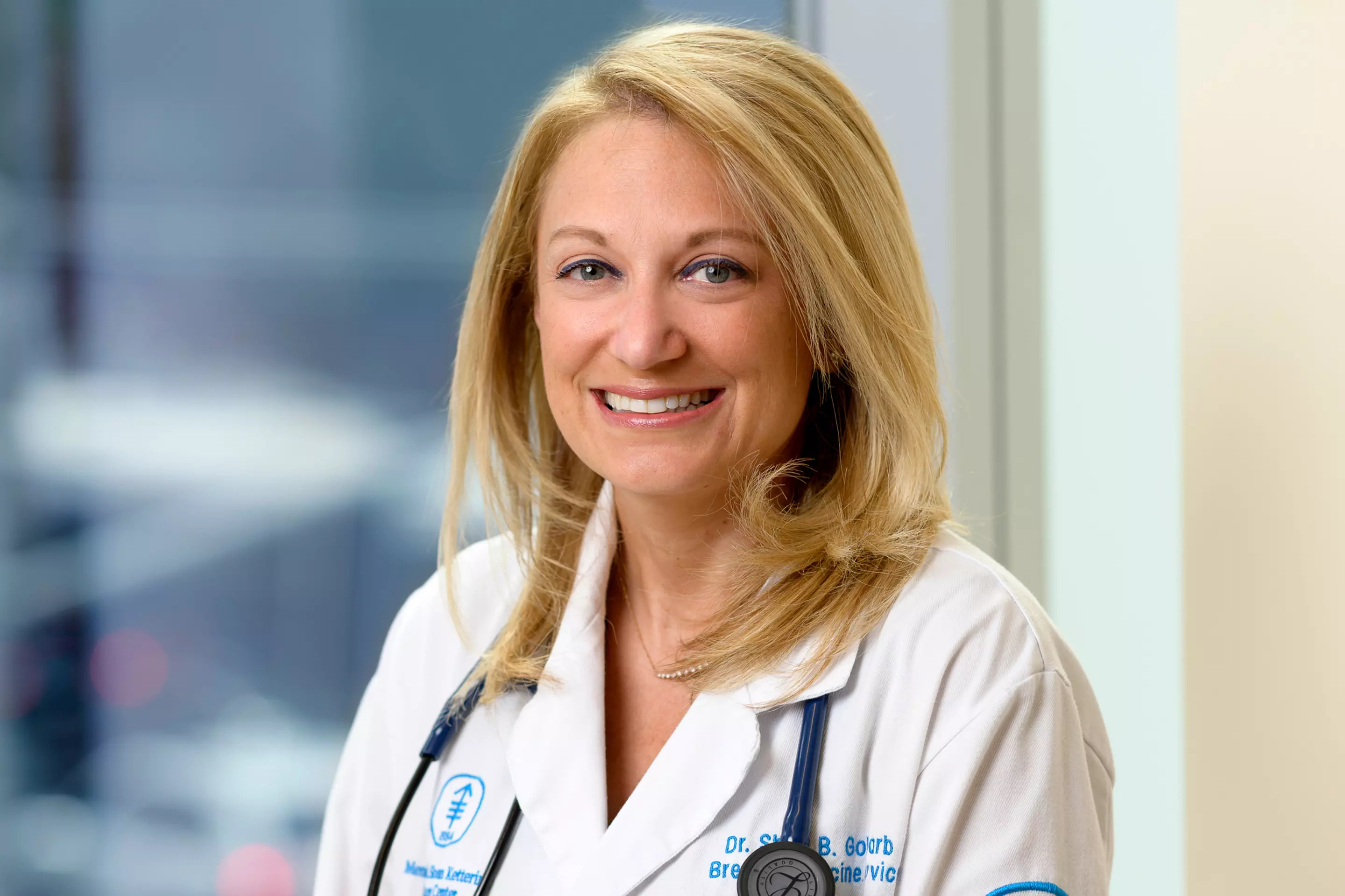 Breast oncologist Shari Goldfarb is with a patient 